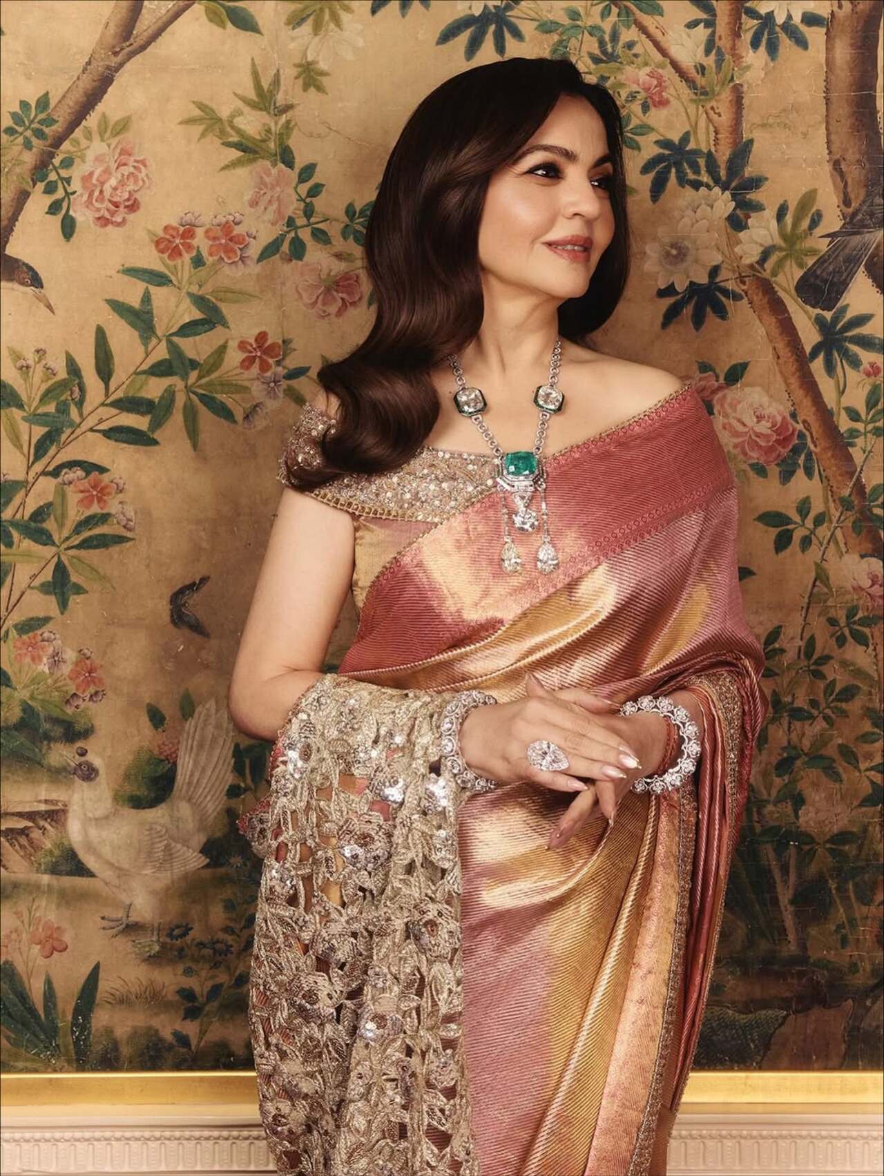 She paired it with an off-shoulder corset-style choli that was fastened by bejewelled buttons, also by Malhotra’s couture label